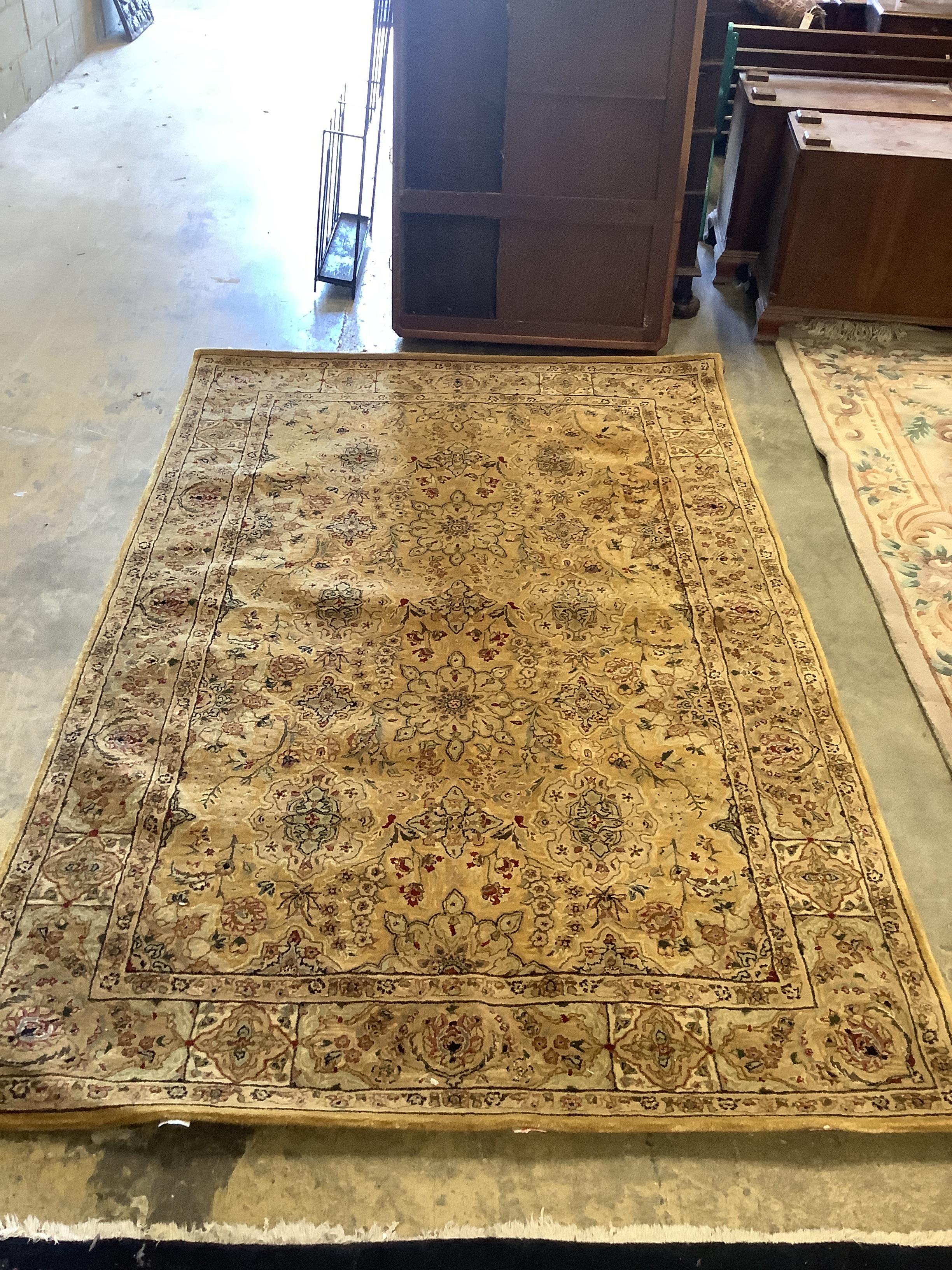 A North West Persian style gold ground carpet, 254 x 170cm